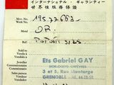 an old document with chinese writing on it sitting on top of a table