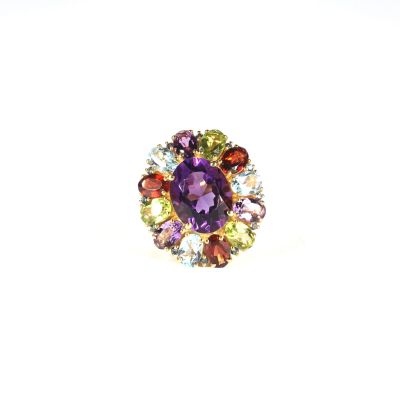 an image of a close up of a purple ring with multi colored stones