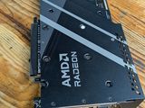 a close up of a video card sitting on top of a wooden table