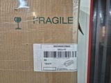 a box with a fragile label on it sitting on a shelf
