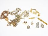 a lot of jewelry that is laying out on the table