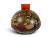 a vase with a painting on it on a white surface