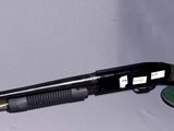 a gun that is laying on the ground next to a case