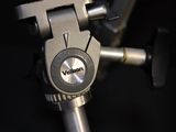 a close up of a tripod with a camera on it