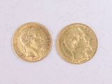 two pieces of gold coins with a portrait of a man and a woman on them