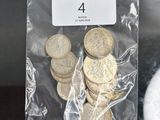 a bag of coins sitting next to a plate of food