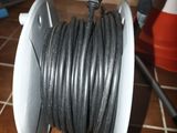 an image of a spooler with a hose attached to it