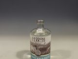 a small bottle of alcohol sitting on a table