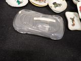 a lot of small dishes and cups on the table