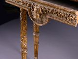a wooden table with a marble top on it