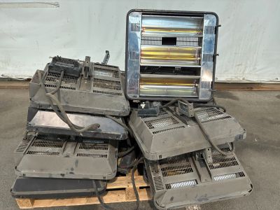 a pile of old electronic equipment sitting on a pallet