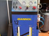 an image of a blue machine sitting on top of a wooden floor