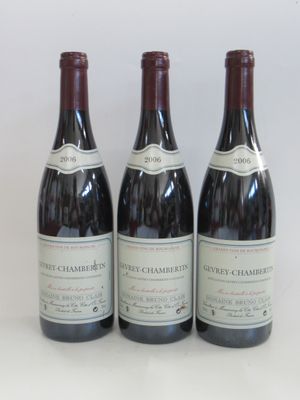 three bottles of wine sitting on top of a table next to each other