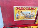 a red box with a toy train inside of it