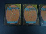 two decks of magic the gathering are sitting on a table