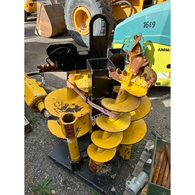 an image of a yellow machine is parked in a lot