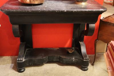 a black table with a pot on top of it