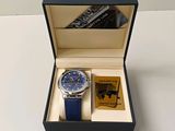 a watch in a black box with a blue strap