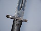 a close up of a knife with a metal handle