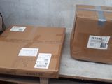 two boxes sitting on a pallet next to each other