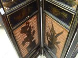 a black and gold screen with a bird on it