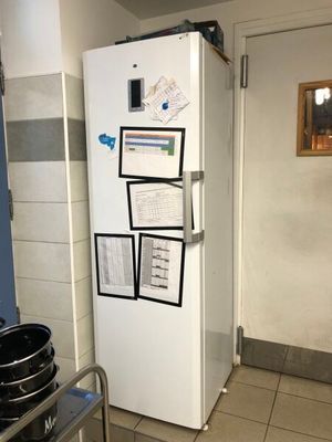an image of a kitchen with a refrigerator and a stove