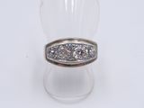 an image of a ring with three diamonds on it on a white surface