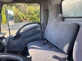 a seat in the back of a truck with a seat cover