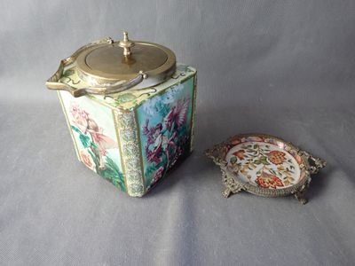 a tea pot and a plate sitting on a table