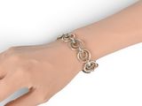 silver plated chain link bracelet on a female ' s hand