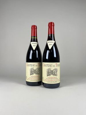 two bottles of red wine sitting next to each other on a table