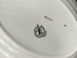a white plate with a picture of a windmill on it