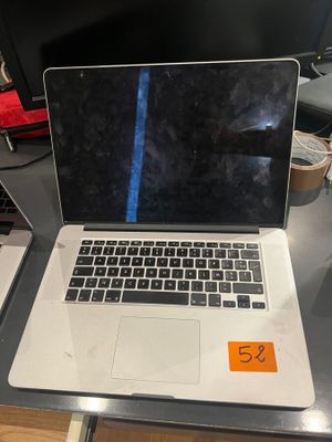 a laptop computer sitting on a desk with a price tag on it
