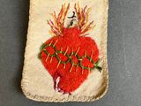 a close up of a piece of cloth with a heart on it