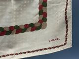 a chanel scarf hanging on a clothes line
