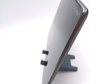 a close up of a cell phone on a stand