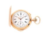 une image d'une montre de poche en or avec des chiffres romains sur le cadran