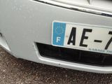 a close up of a license plate on the front of a car
