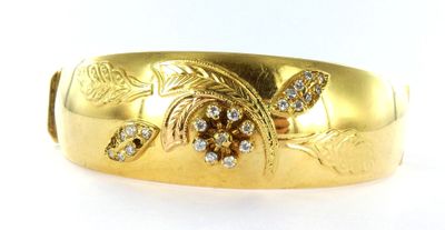 an image of a close up of a gold ring on a white background