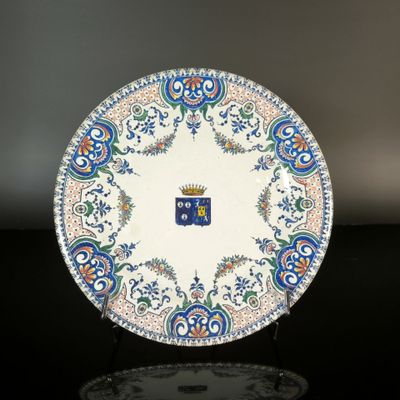 a blue and white plate with a crown on it