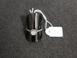 a silver ring with a diamond on it sitting on a black surface