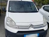 a white van parked in a parking lot next to other cars