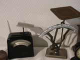 a scale and a clock on a table next to a clock
