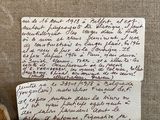 a piece of paper with writing on it sitting on a shelf
