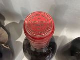 three bottles of wine sitting next to each other on a table