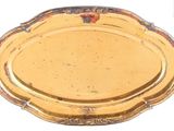 a gold tray with a decorative design on it