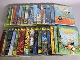 a lot of children ' s books that are on the table
