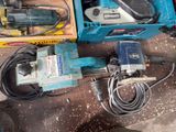 two electric tools that are sitting on the floor