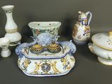 many different pieces of porcelain on display on the table
