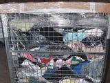 a metal cart with a lot of clothes in it